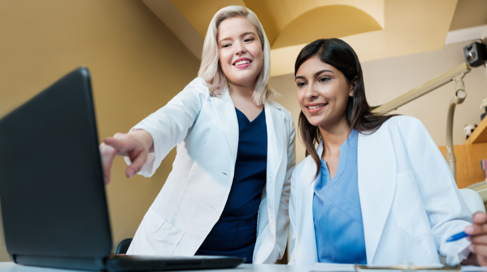 dentists looking at computer