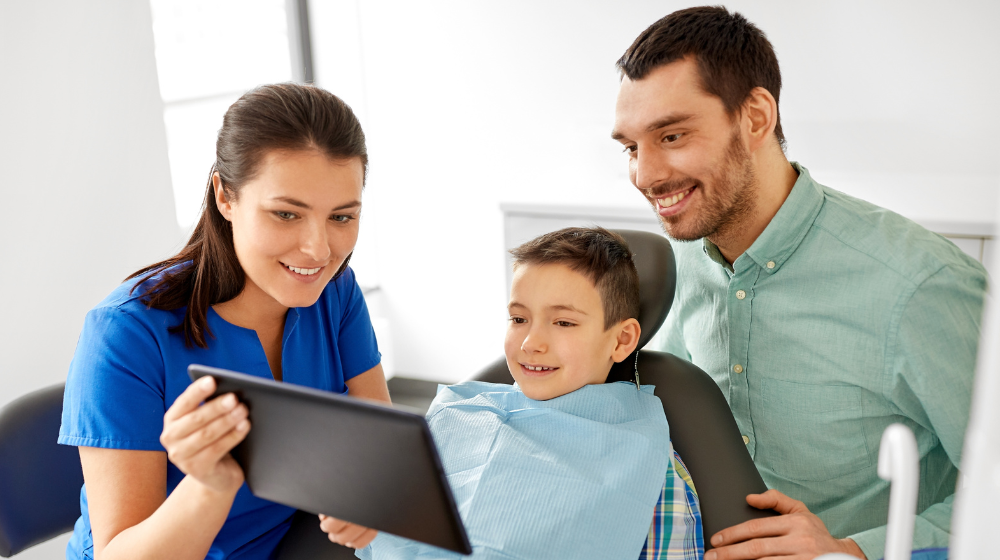 dentist showing patient treatment plans